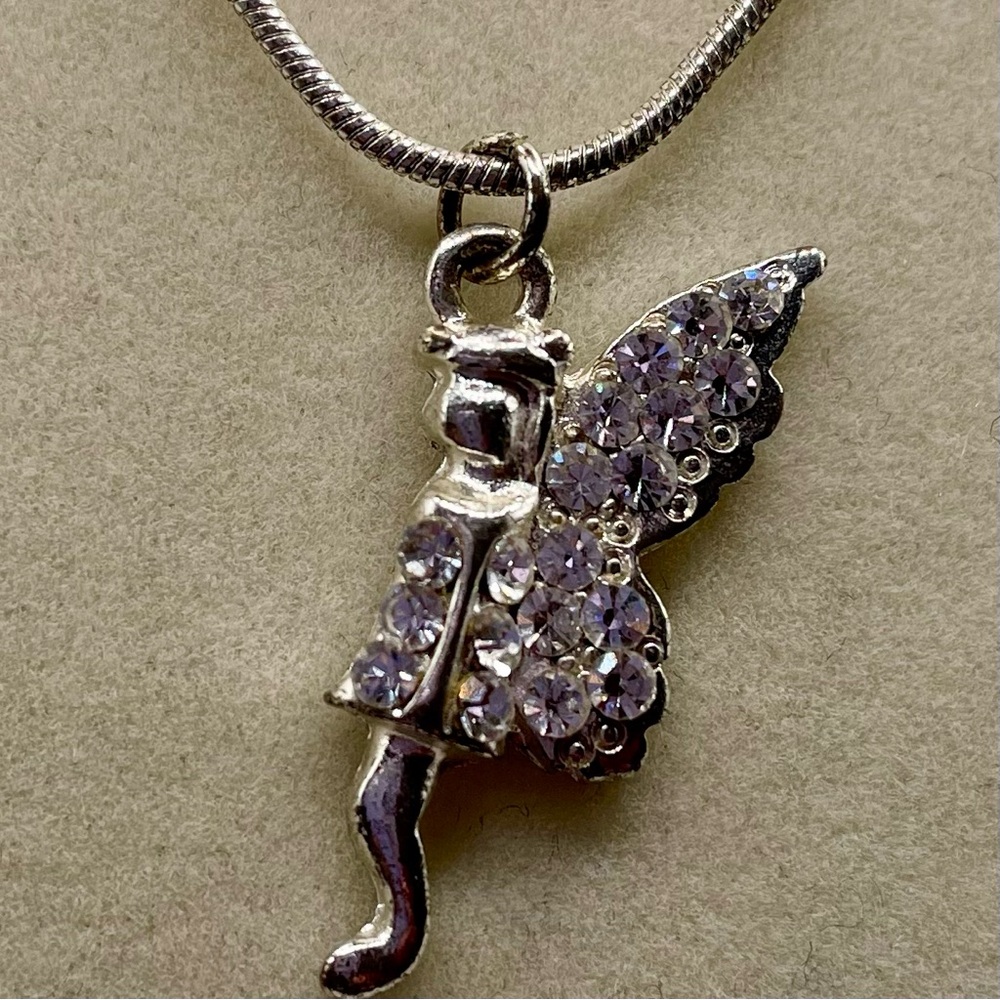 Rhinestone fairy pendant necklace. 18 inches long. Silver tone. Magical